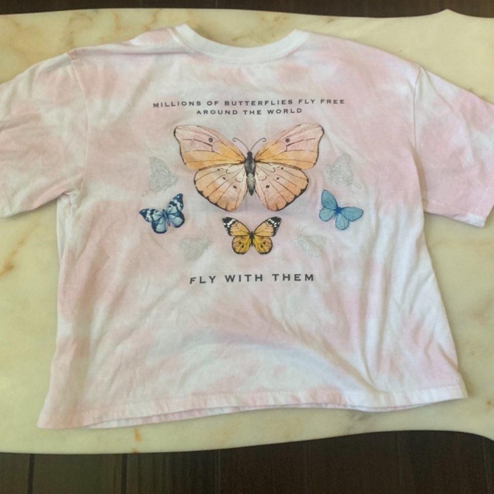 I am selling a colorful butterfly top perfect with any outfit!!